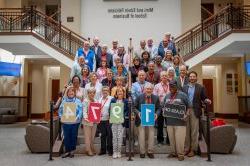 Class of 1974 poses on stairs