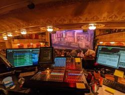 Image of Broadway stage from behind technical equipment